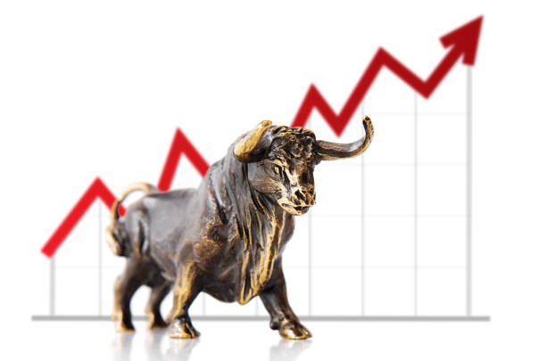 istock Bull in front of a chart with an arrow indicating uptrend 1305283601