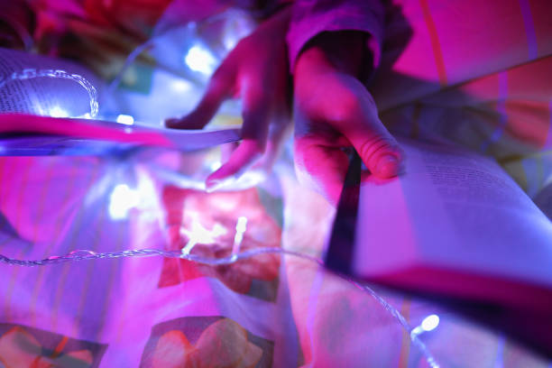 istock Mother and daughter reading books under LED light 1305284882