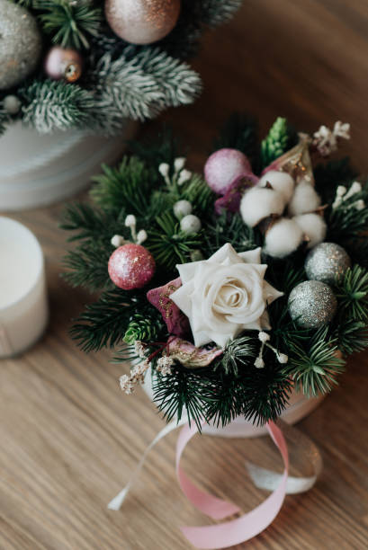 istock New Year's gift from artificial flowers. Beautiful christmas present 1305285073