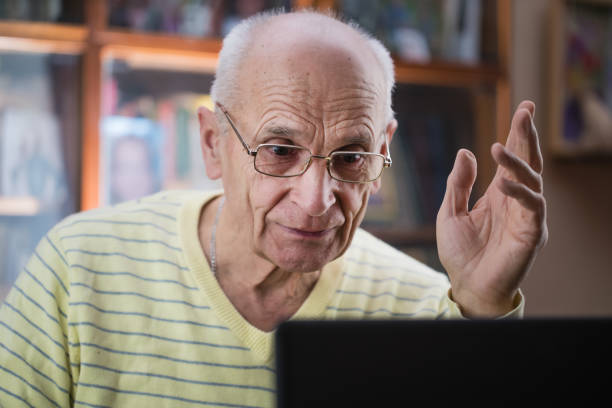istock Retired elder man in glasses has online communication with family. 1305286208