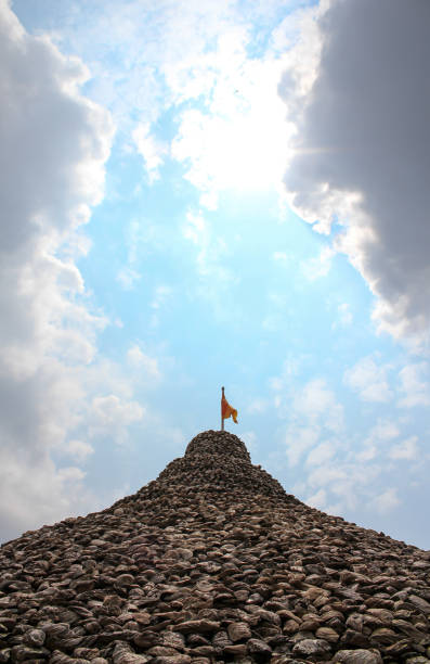 istock Pagoda made from shells at Thai temples with one bird, beautiful blue sky and sunlight. 1305288036