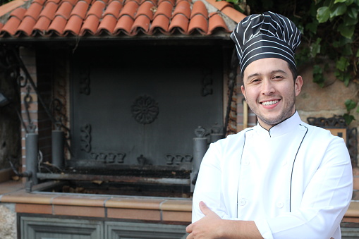 Traditional chef with black and white uniform.