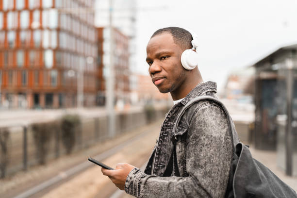 istock Student on his way home from university with smartphone in hand 1305291787
