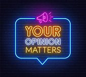 istock Your opinion matters neon sign on brick wall background. 1305292052