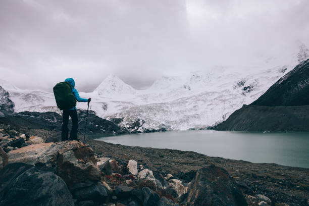 istock Woman hiker in winter high altitude mountains 1305293814