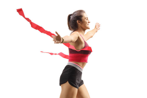 istock Young female winner runner on the finish line 1305295577