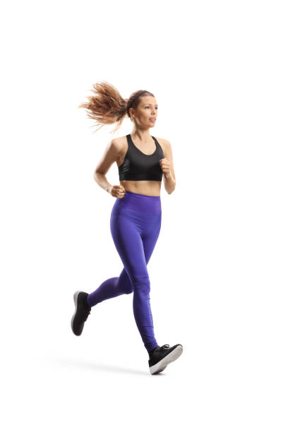 Full length shot of a slim young woman in sportswear running Full length shot of a slim young woman in sportswear running isolated on white background jogging stock pictures, royalty-free photos & images