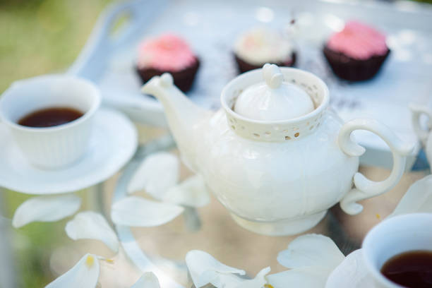 istock Tea drinking black tea with porcelain cups and a teapot 1305297025