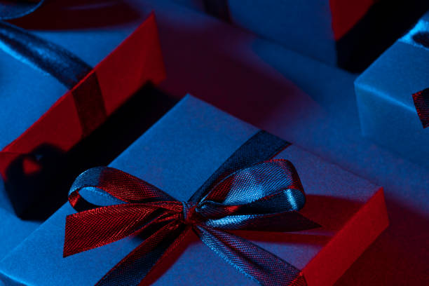 istock Blue red gift box close up on dark background 1305297072