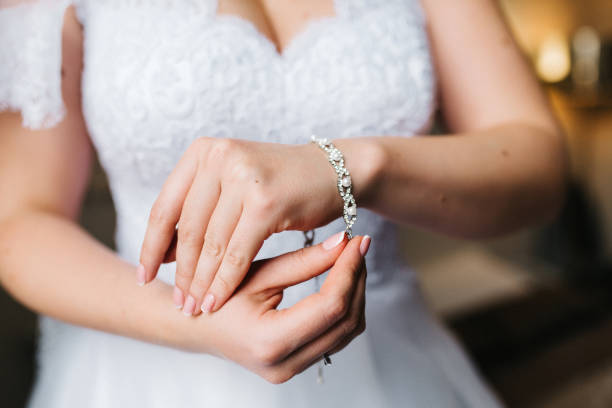 istock the bride wears a wedding bracelet on her left hand 1305297638