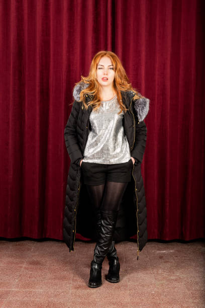 istock Redhead woman is acting on theater stage 1305298659