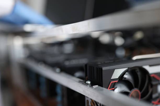 istock Master repairing video card from mining farm closeup 1305299767