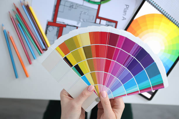 istock Female hands holding palette with color samples closeup 1305301443