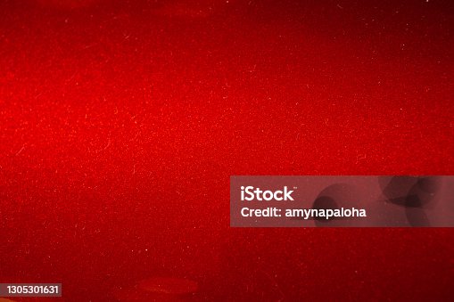 istock Close up of red metallic car paint surface wallpaper background 1305301631