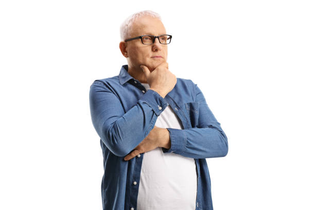 istock Pensive mature man looking in distance 1305302216