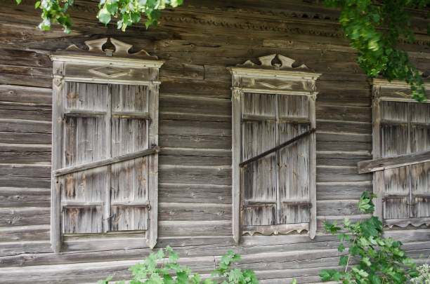 Very beautiful old windows with closed shutters, Piedruja, Latvia