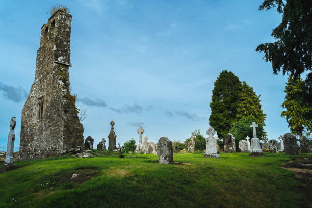 istock Small ancient cemetery and ruined church tower. Celtic style gravestones. 1305304174