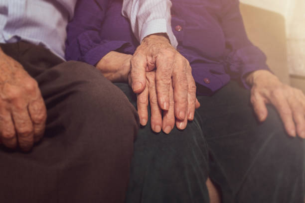 istock Elderly couple hands. Elderly support. Nursing home. 1305305358