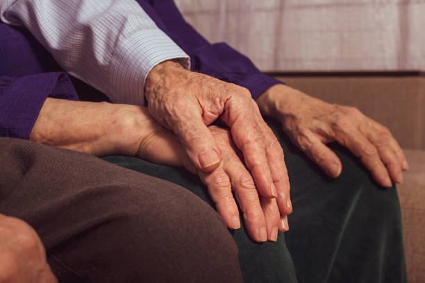 istock Elderly husband holds wife's hand. Care concept. 1305305361