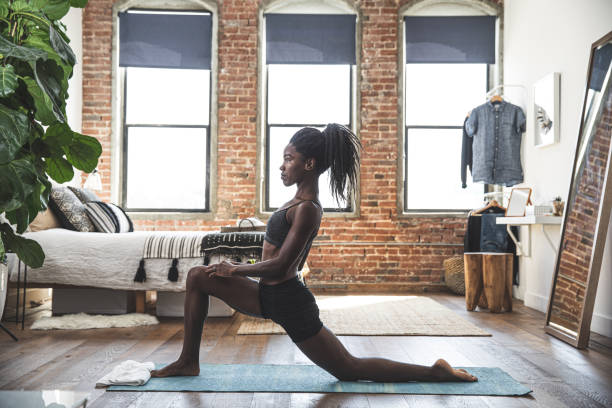 istock Athlete woman exercising at home while gym are closed 1305307231