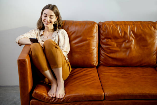 istock Woman using Smartphone on home interior background. 1305308946