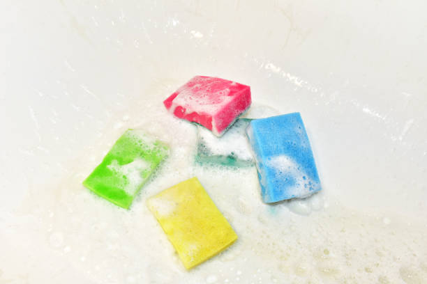 istock Sponge with detergent and foam while cleaning bathroom or toilet. 1305310669