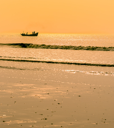 Mandarmani, West Bengal, India.- February, 19, 2021. Picture of Ocean water at the time of Golden Hour.. Selective focus is used.