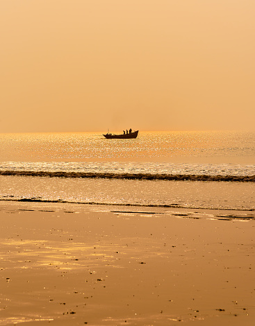 Mandarmani, West Bengal, India.- February, 19, 2021. Picture of Ocean water at the time of Golden Hour.. Selective focus is used.