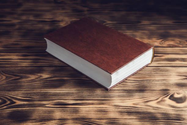 antique book on the wooden table.