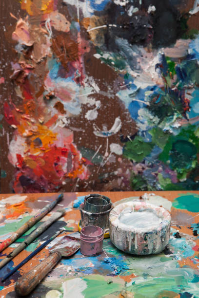 istock Oil paints and paint brushes on a palette 1305313908