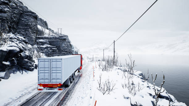 Red truck transport with container on winter road stock photo
