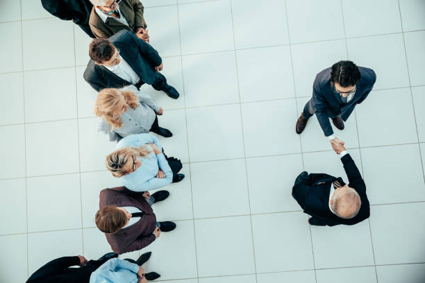 istock top view. reliable business partners shaking hands 1305314159