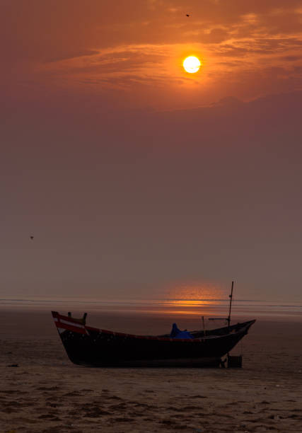 Fishing Boat. Silhouette of A Fishing boat on the Beach. Selective Focus is used. bengal beach stock pictures, royalty-free photos & images