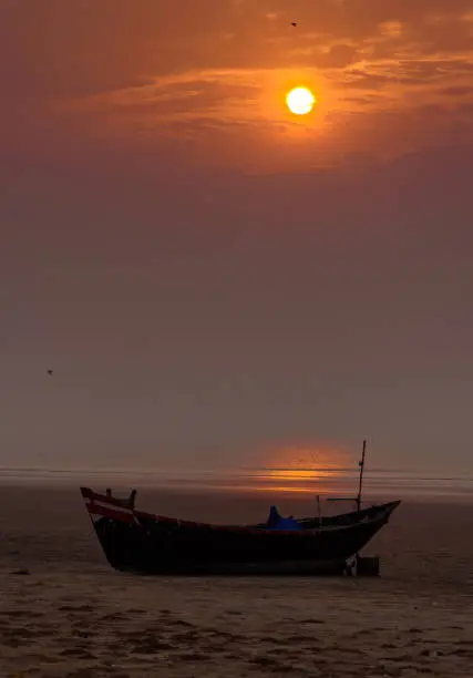 Silhouette of A Fishing boat on the Beach. Selective Focus is used.