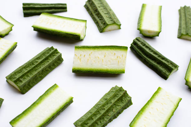 Fresh luffa vegetables on white. Fresh luffa vegetables on white background. waxed gourds stock pictures, royalty-free photos & images