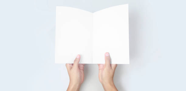 istock Hands holding paper blank for letter paper 1305316246