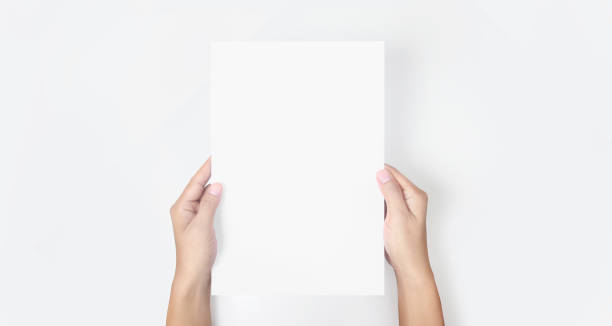 istock Hands holding paper blank for letter paper 1305316248