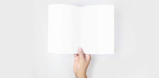 istock Hands holding paper blank for letter paper 1305316253