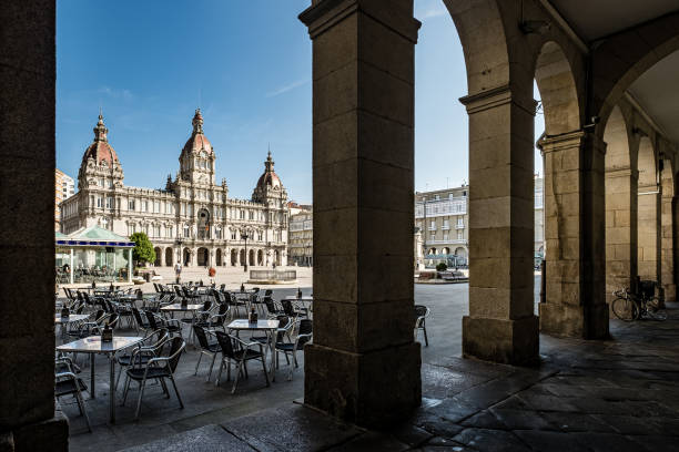 Plaza de María Pita and town hall. La Coruña. View of the Town Hall through the arcades of the Maria Pita square. a coruna province stock pictures, royalty-free photos & images