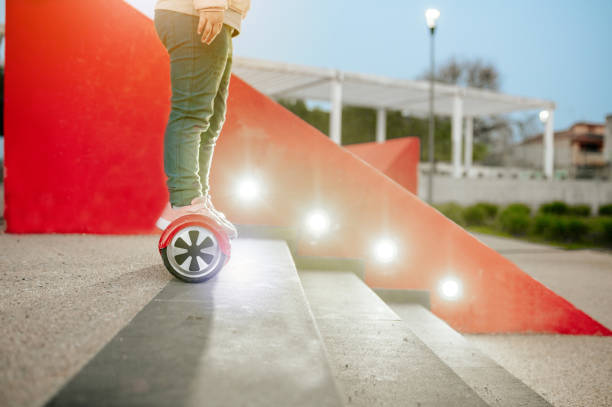 istock Cropped unrecognizable girl on hoverboard with lights on background and stairs. 1305318007