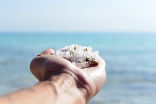 Female hand with sea salt for spa from Dead Sea