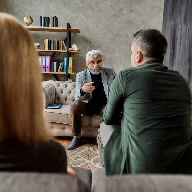istock Professional psychoanalyst talking to upset young spouses 1305322672