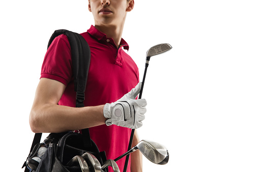 Close up. Golf player in a red shirt isolated on white studio background with copyspace. Professional player practicing with emotions and facial expression. Sport, motion, action concept.