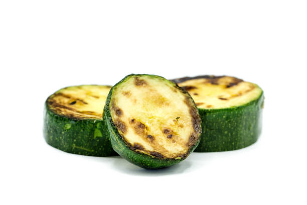 istock Grilled zucchini isolated on white background 1305326565