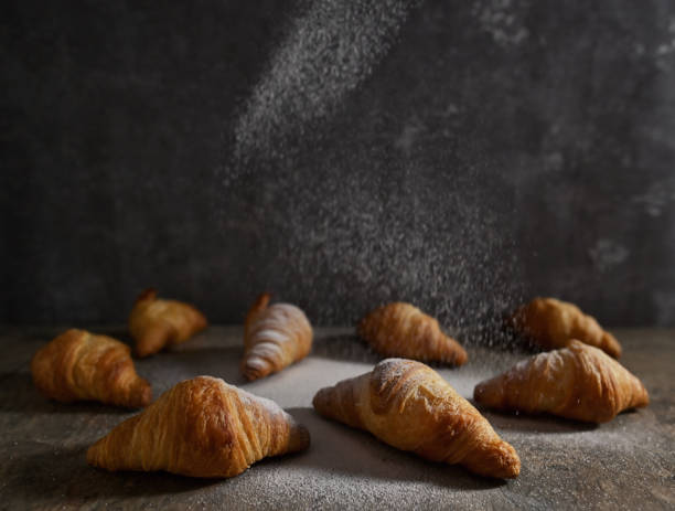 istock Closeup Fresh mini croissants on stone table 1305327413