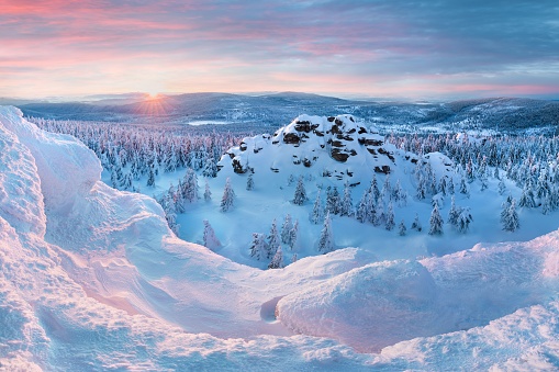 Panoramic landscape of Jizera Mountains, view from peak Izera with frosty spruce forest, trees and hills. Winter time near ski resort, blue sky background. Liberec, Czech Republic, Northern Bohemia