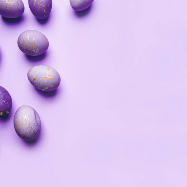 istock Easter frame of eggs painted in purple color. 1305329441