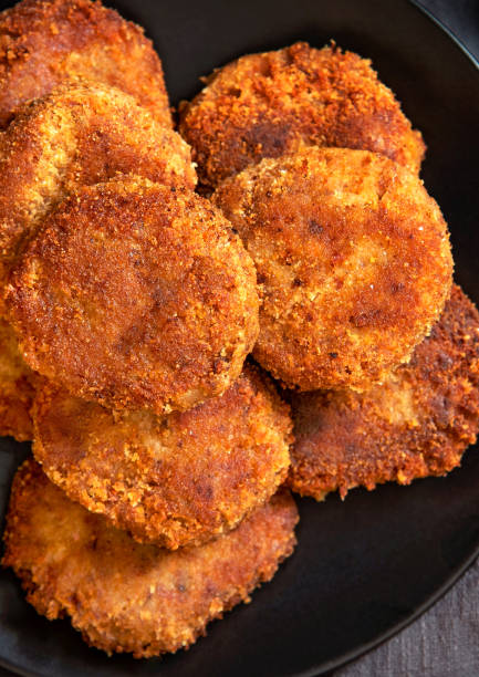 istock Juicy homemade cutlets on a black plate 1305330342