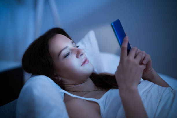 istock Snoozing Off Alarm At Night In Bed 1305330826