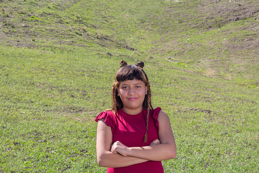 portrait of beautiful Mexican teenager in the mountains. indigenous girl